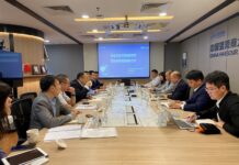 马建华会见中信保监事长唐志刚